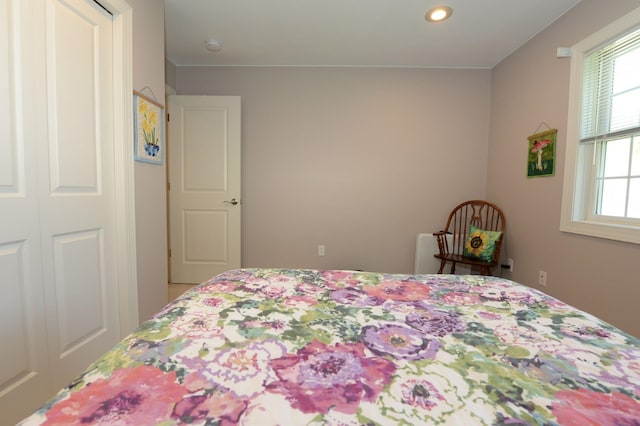 722 Bennington St, East Tawas, MI 48730 - bedroom featuring multiple windows and recessed lighting