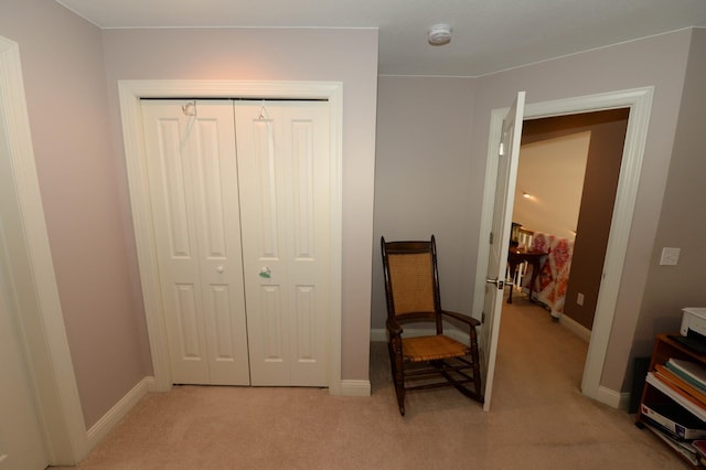 722 Bennington St, East Tawas, MI 48730 - bedroom featuring light colored carpet, a closet, and baseboards