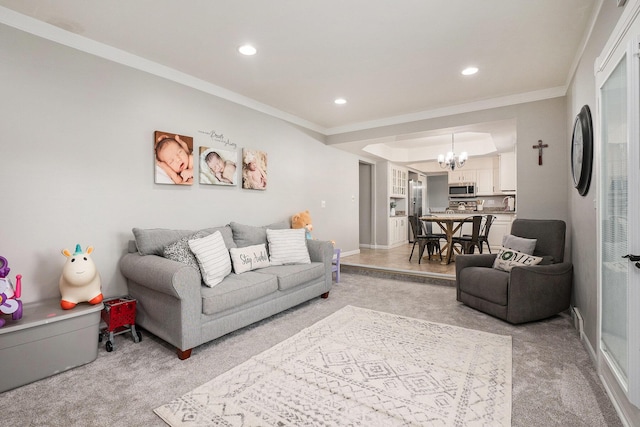 living room with light carpet, a chandelier, crown molding, recessed lighting, and baseboards