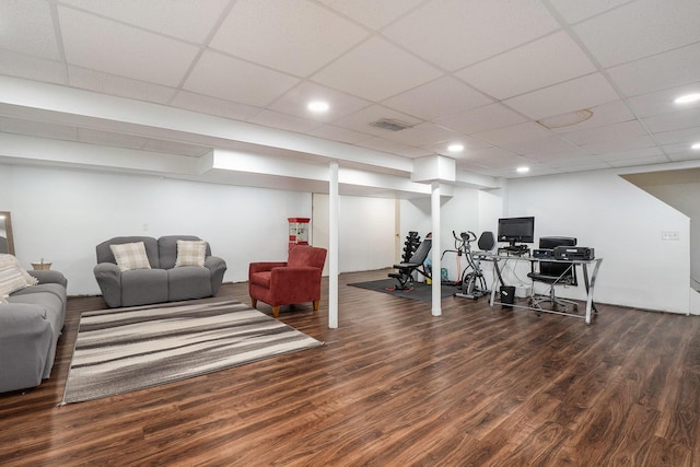 workout area featuring wood finished floors and recessed lighting