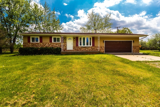 789 W Castle Rd, Fostoria, MI 48435 - ranch-style home with brick siding, concrete driveway, an attached garage, and a front lawn