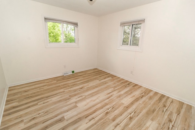 789 W Castle Rd, Fostoria, MI 48435 - spare room featuring plenty of natural light, baseboards, and light wood-type flooring