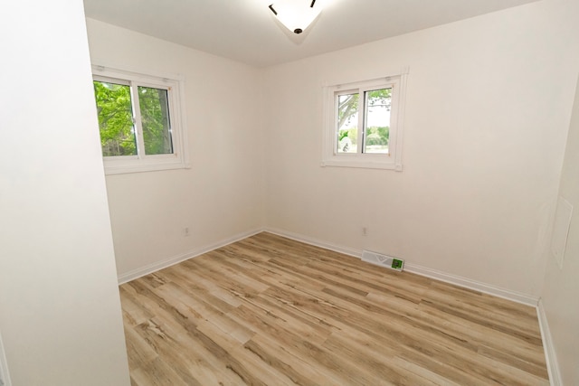 789 W Castle Rd, Fostoria, MI 48435 - unfurnished room with plenty of natural light, light wood finished floors, and baseboards