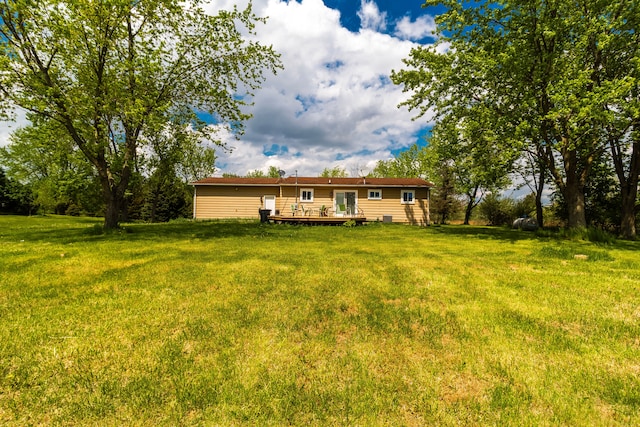 789 W Castle Rd, Fostoria, MI 48435 - view of front of home with a deck and a front yard