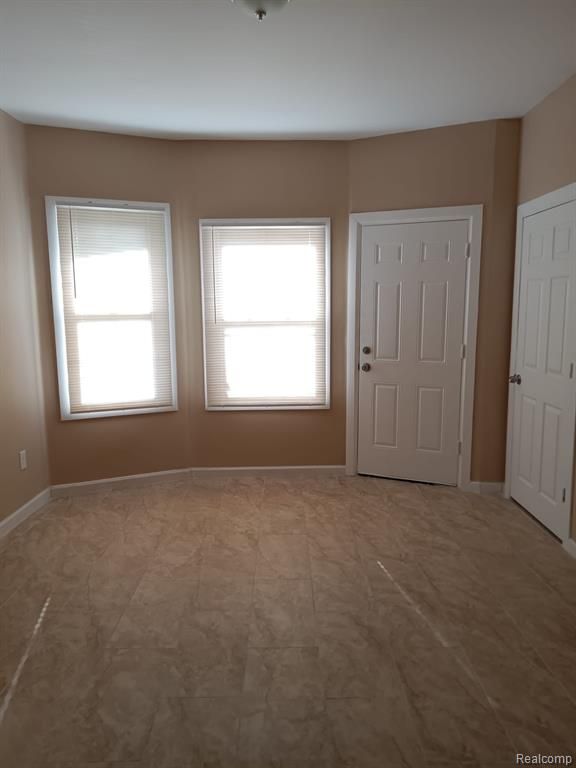8879 N Clarendon St, Detroit, MI 48204 - entrance foyer with plenty of natural light and baseboards