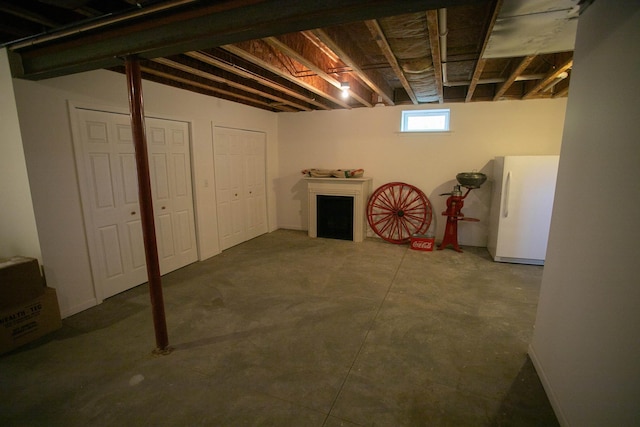 1820 Elk Ct, Owosso, MI 48867 - below grade area with freestanding refrigerator