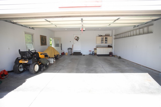 1820 Elk Ct, Owosso, MI 48867 - garage featuring a garage door opener