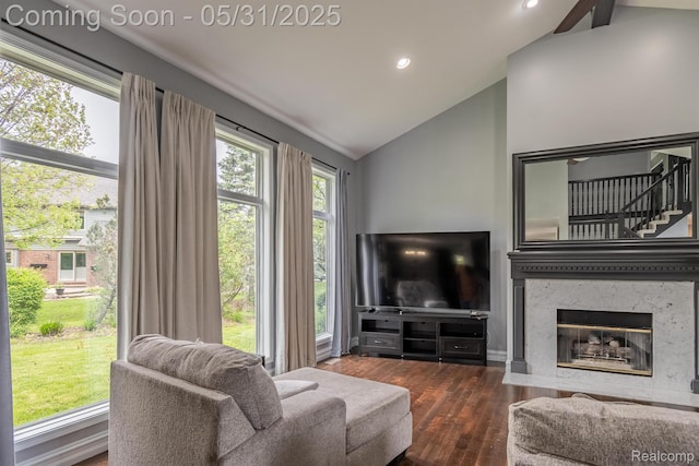 42739 Pond View Dr, Sterling Heights, MI 48314 - living area featuring lofted ceiling, wood finished floors, recessed lighting, and a premium fireplace
