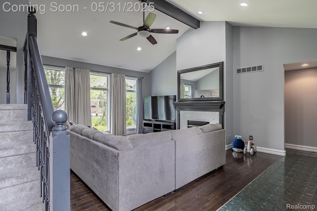 42739 Pond View Dr, Sterling Heights, MI 48314 - living room featuring beamed ceiling, a fireplace, a ceiling fan, wood finished floors, and baseboards