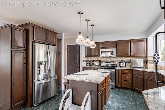 42739 Pond View Dr, Sterling Heights, MI 48314 - kitchen featuring appliances with stainless steel finishes, backsplash, light stone countertops, hanging light fixtures, and a center island