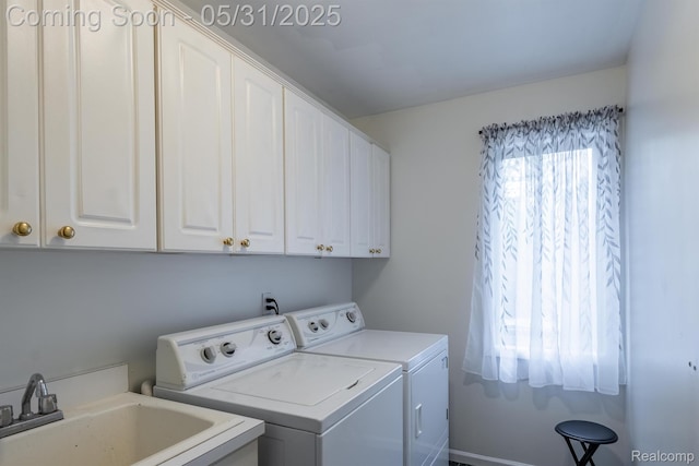 42739 Pond View Dr, Sterling Heights, MI 48314 - washroom featuring separate washer and dryer and cabinet space