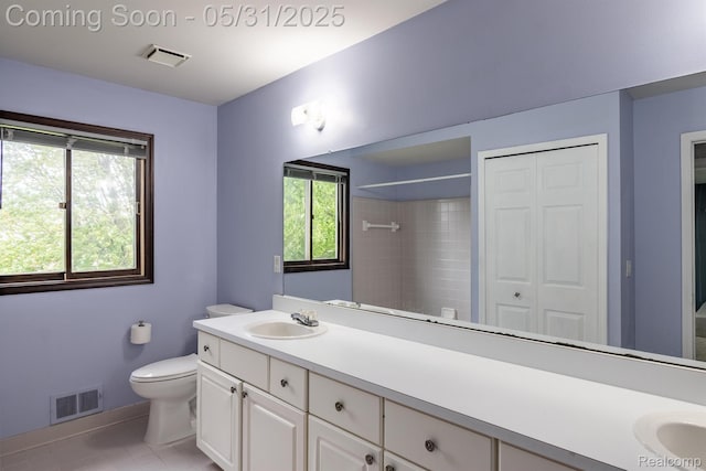 42739 Pond View Dr, Sterling Heights, MI 48314 - bathroom with toilet, double vanity, a shower, baseboards, and tile patterned floors