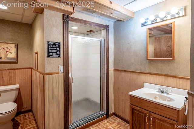 42739 Pond View Dr, Sterling Heights, MI 48314 - full bathroom with wainscoting, toilet, vanity, a stall shower, and wooden walls