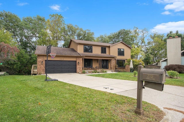 2315 Adare Rd, Ann Arbor, MI 48104 - view of front of property featuring brick siding, a garage, a front yard, concrete driveway, and covered porch