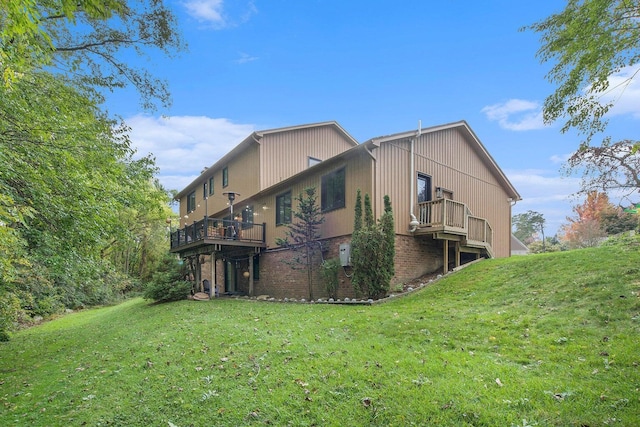 2315 Adare Rd, Ann Arbor, MI 48104 - back of property with a yard, brick siding, and a wooden deck