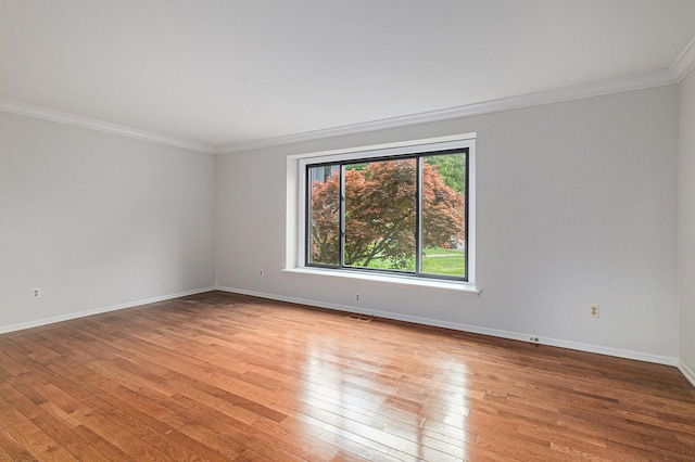 2315 Adare Rd, Ann Arbor, MI 48104 - unfurnished room with crown molding, light wood-style flooring, and baseboards
