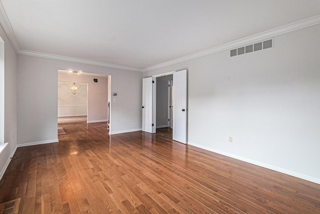 2315 Adare Rd, Ann Arbor, MI 48104 - unfurnished room with baseboards, crown molding, wood finished floors, and a chandelier
