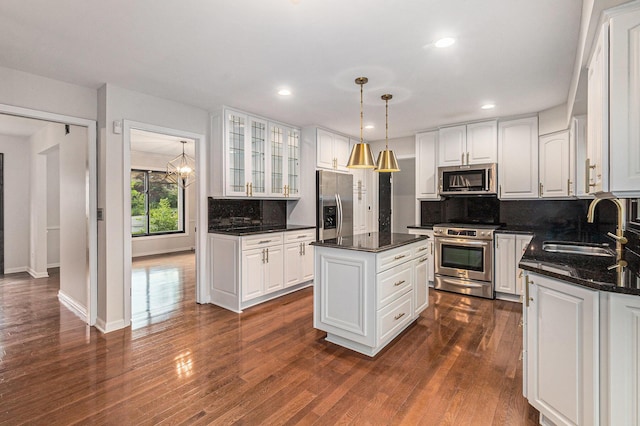 2315 Adare Rd, Ann Arbor, MI 48104 - kitchen featuring stainless steel appliances, a sink, white cabinets, a kitchen island, and recessed lighting