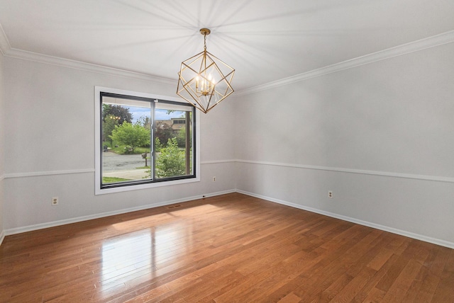 2315 Adare Rd, Ann Arbor, MI 48104 - unfurnished room with light wood finished floors, a chandelier, baseboards, and crown molding