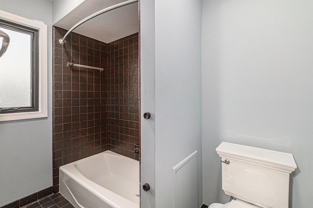 2315 Adare Rd, Ann Arbor, MI 48104 - full bathroom with tile patterned floors, baseboards, shower / washtub combination, and toilet