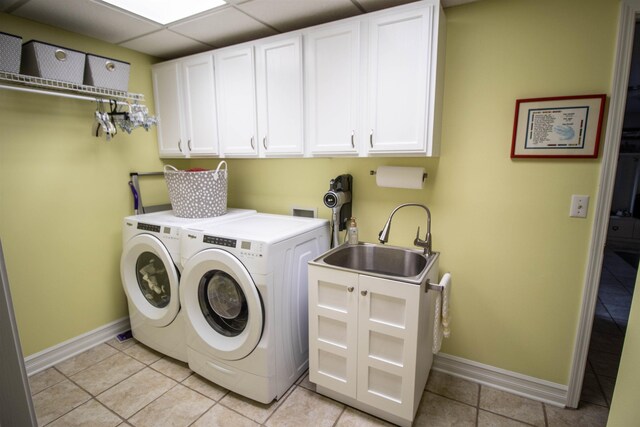 5221 Whittaker Trl, Linden, MI 48451 - washroom with cabinet space, baseboards, washing machine and clothes dryer, and light tile patterned floors