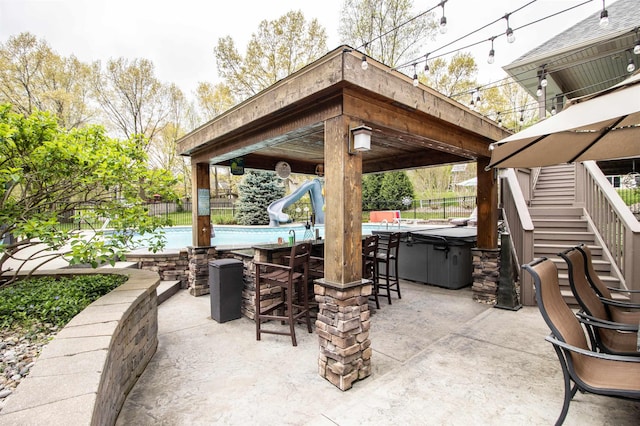 5221 Whittaker Trl, Linden, MI 48451 - view of patio / terrace with a gazebo, stairway, and fence