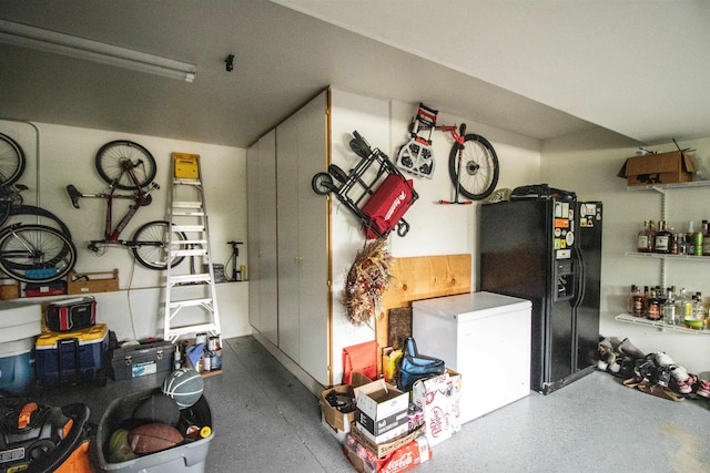 5221 Whittaker Trl, Linden, MI 48451 - garage with black fridge with ice dispenser and white refrigerator