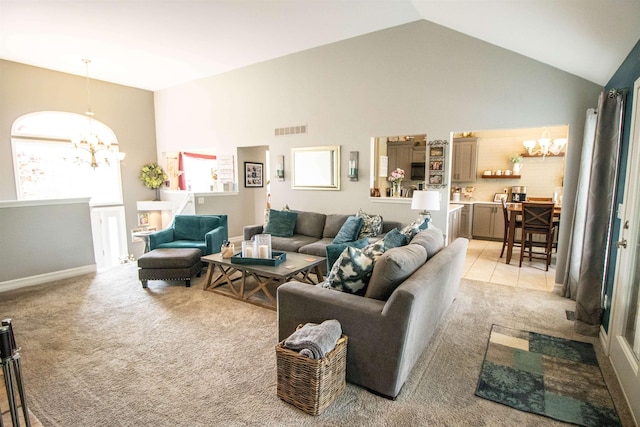 5221 Whittaker Trl, Linden, MI 48451 - living area with a chandelier, light carpet, high vaulted ceiling, and baseboards