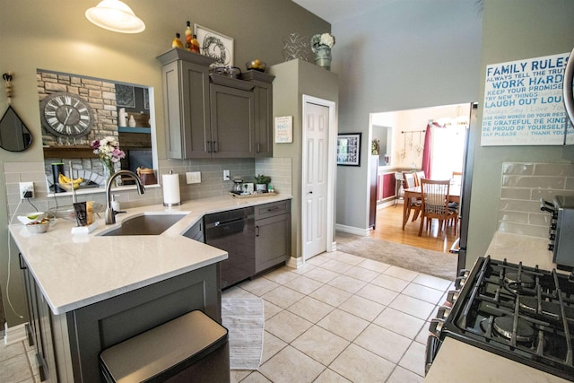 5221 Whittaker Trl, Linden, MI 48451 - kitchen featuring dishwasher, a sink, gray cabinets, light countertops, and light tile patterned flooring