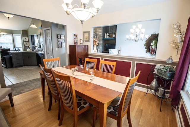 5221 Whittaker Trl, Linden, MI 48451 - dining space with a chandelier and light wood finished floors
