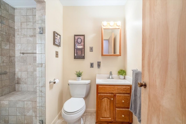 7045 Crane Rd, Ypsilanti, MI 48197 - bathroom with toilet, tiled shower, vanity, tile patterned floors, and baseboards