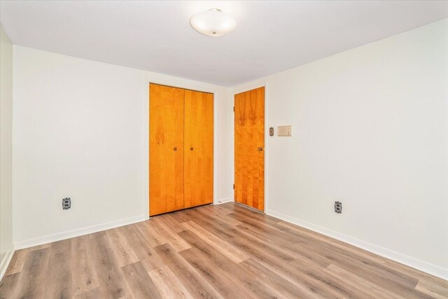 7045 Crane Rd, Ypsilanti, MI 48197 - spare room featuring wood finished floors and baseboards