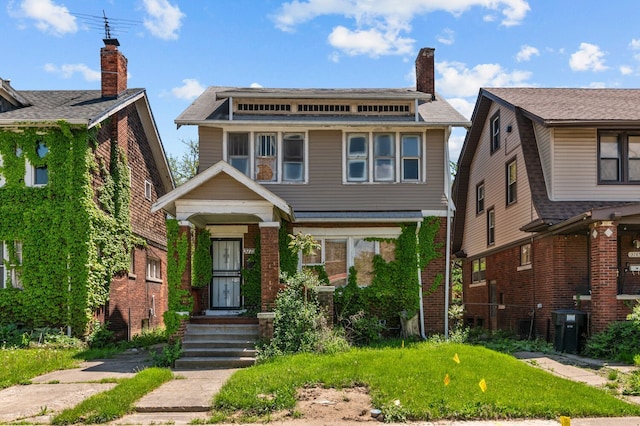 3779 Gladstone St, Detroit, MI 48206 - view of front facade featuring brick siding and a chimney