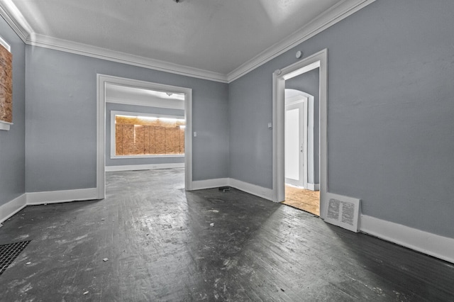 3779 Gladstone St, Detroit, MI 48206 - spare room featuring crown molding, arched walkways, and baseboards