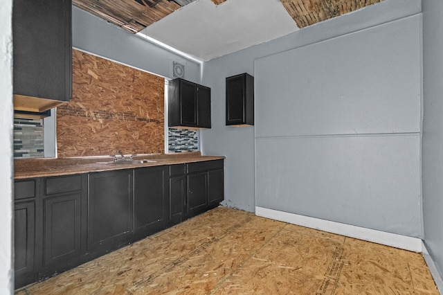 3779 Gladstone St, Detroit, MI 48206 - kitchen featuring dark cabinets and a sink