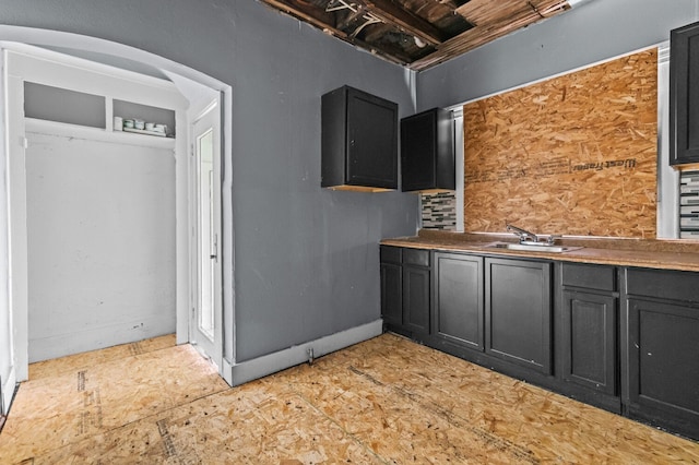 3779 Gladstone St, Detroit, MI 48206 - kitchen featuring a sink and dark cabinets