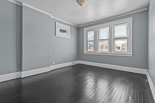 3779 Gladstone St, Detroit, MI 48206 - empty room featuring crown molding, dark wood-style flooring, and baseboards