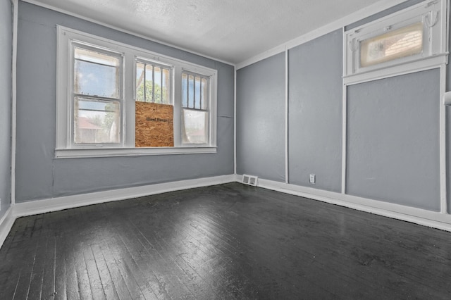 3779 Gladstone St, Detroit, MI 48206 - spare room with dark wood-type flooring and baseboards
