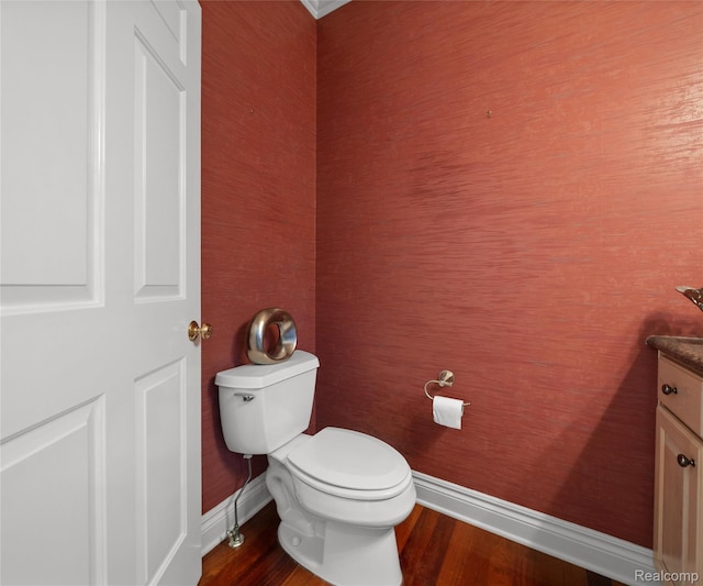 17747 Parkshore Dr, Northville, MI 48168 - bathroom featuring baseboards, toilet, wood finished floors, and vanity