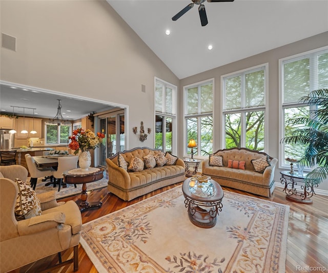17747 Parkshore Dr, Northville, MI 48168 - living room featuring light wood-type flooring, recessed lighting, ceiling fan, and high vaulted ceiling