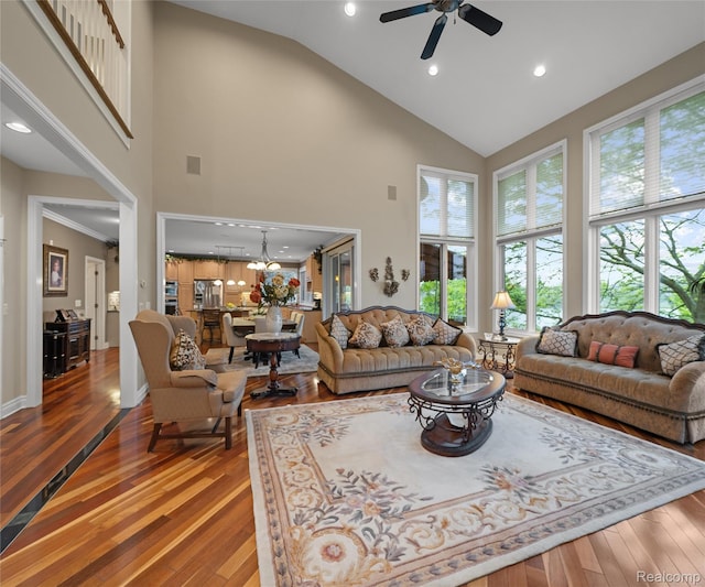 17747 Parkshore Dr, Northville, MI 48168 - living area with high vaulted ceiling, hardwood / wood-style flooring, ceiling fan, a chandelier, and recessed lighting