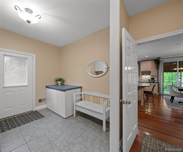 17747 Parkshore Dr, Northville, MI 48168 - foyer entrance with baseboards and light tile patterned floors