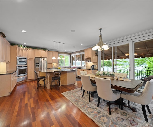 17747 Parkshore Dr, Northville, MI 48168 - dining area featuring dark wood-style floors, recessed lighting, a chandelier, and ornamental molding