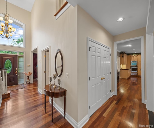 17747 Parkshore Dr, Northville, MI 48168 - entryway with a chandelier, dark wood-style flooring, baseboards, and recessed lighting