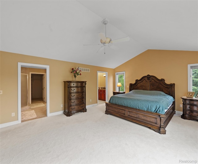 17747 Parkshore Dr, Northville, MI 48168 - carpeted bedroom featuring vaulted ceiling, ensuite bathroom, baseboards, and ceiling fan