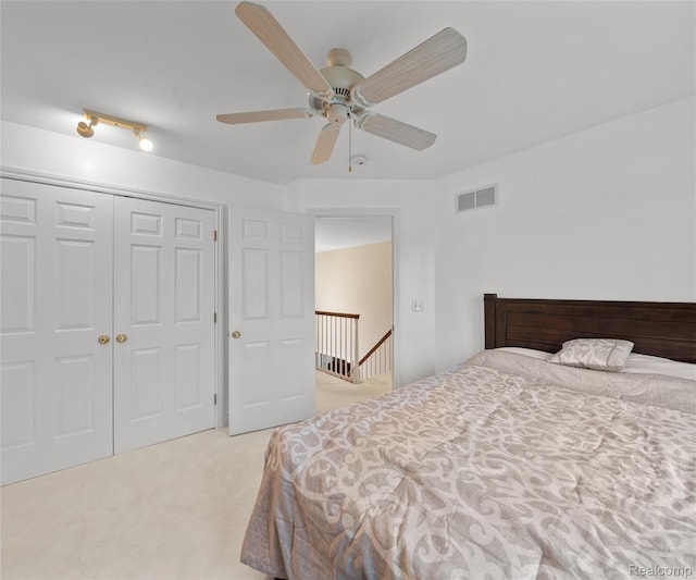 17747 Parkshore Dr, Northville, MI 48168 - bedroom featuring light colored carpet, a closet, and ceiling fan