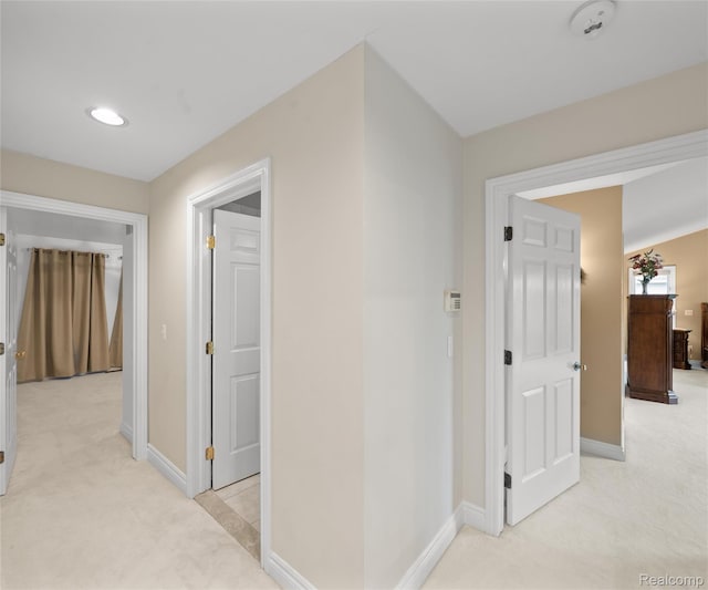 17747 Parkshore Dr, Northville, MI 48168 - corridor with light colored carpet, baseboards, and recessed lighting