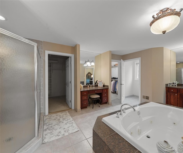 17747 Parkshore Dr, Northville, MI 48168 - full bath with a shower stall, a walk in closet, vanity, a jetted tub, and tile patterned floors
