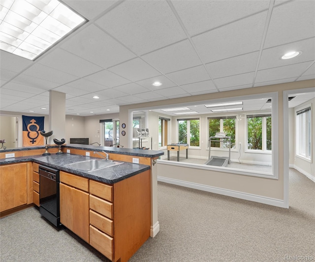 17747 Parkshore Dr, Northville, MI 48168 - kitchen with a sink, light colored carpet, black dishwasher, open floor plan, and brown cabinetry