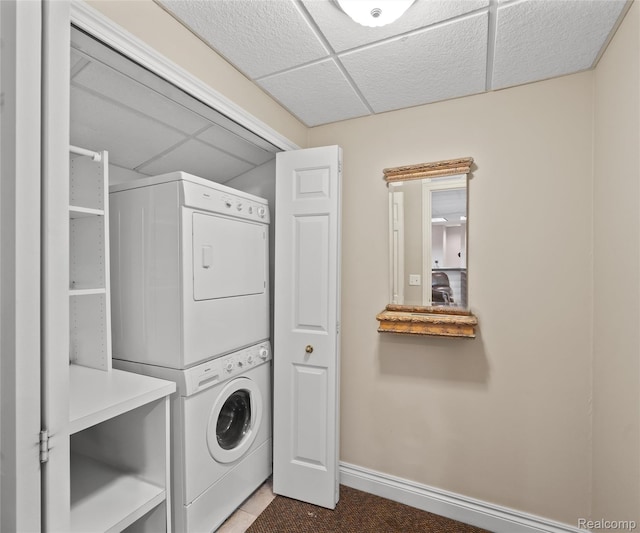 17747 Parkshore Dr, Northville, MI 48168 - washroom with stacked washer / dryer, baseboards, and tile patterned floors